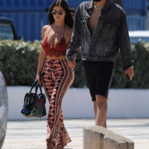 Demi Rose stuns in a daring top and silky trousers while out with her boyfriend in Ibiza