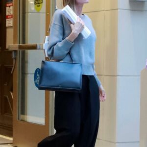Angelina Jolie shows her elegant style in a grey sweater and black trousers while stopping by a friend’s apartment in Los Angeles Angelina Jolie shows her elegant style in a grey sweater and black trousers while stopping by a friend’s apartment in Los Angeles