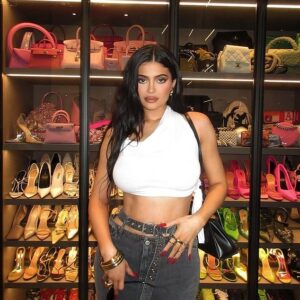 Kylie Jenner shows off her taut tummy in a white crop top while displaying her vast shoe and purse collection Kylie Jenner shows off her taut tummy in a white crop top while displaying her vast shoe and purse collection