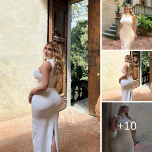 Watch the transformation as Anastasiya Kvitko dazzles in a stunning fitted white dress, embodying elegance and sophistication with every step she takes. Watch the transformation as Anastasiya Kvitko dazzles in a stunning fitted white dress, embodying elegance and sophistication with every step she takes.