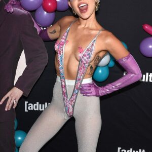 Miley Cyrus brings bold style to the Adult Swim Upfront event with ʙuттerfly pasties and a monokini, proving fearless fashion knows no bounds. Miley Cyrus brings bold style to the Adult Swim Upfront event with ʙuттerfly pasties and a monokini, proving fearless fashion knows no bounds.