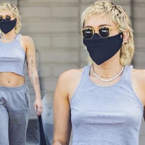 Miley Cyrus goes braless in a racerback tank top as she loads up on essentials